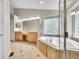 Elegant bathroom showcasing a soaking tub, double vanity, and stylish tile flooring at 16500 Hitching Post Cir, Parker, CO 80134