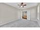 Bedroom featuring a ceiling fan and a doorway leading to another room at 16500 Hitching Post Cir, Parker, CO 80134