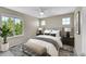Bedroom featuring a queen bed, bench, bedside tables and lots of natural light at 16500 Hitching Post Cir, Parker, CO 80134