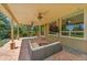 Beautiful covered patio with ceiling fans and comfortable seating, perfect for outdoor relaxation and entertaining at 16500 Hitching Post Cir, Parker, CO 80134