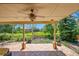 Spacious covered patio offers views of the lovely yard with professional landscaping at 16500 Hitching Post Cir, Parker, CO 80134