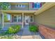 Charming front porch featuring a white railing and purple shutters, creating a welcoming entrance to this lovely home at 16500 Hitching Post Cir, Parker, CO 80134