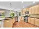 Well-lit kitchen with stainless steel appliances, granite countertops, and hardwood flooring at 16500 Hitching Post Cir, Parker, CO 80134