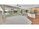 Open concept living room with a fireplace and kitchen with outdoor views at 16500 Hitching Post Cir, Parker, CO 80134