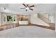 An open-concept room featuring a kitchen, staircase, and lots of natural light at 16500 Hitching Post Cir, Parker, CO 80134
