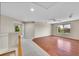 Bright loft area with hardwood flooring and a ceiling fan, perfect for relaxation or entertainment at 16500 Hitching Post Cir, Parker, CO 80134