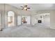 Open floor plan connecting the bedroom to the bathroom, closet, and fireplace sitting area at 16500 Hitching Post Cir, Parker, CO 80134