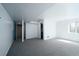 Large basement with gray carpet, white walls, and a window allowing natural light, providing ample space at 17145 Park Trail Dr, Monument, CO 80132