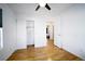 Neat bedroom with wood floors, a closet with sliding doors, and access to the bedroom with a queen bed at 17145 Park Trail Dr, Monument, CO 80132