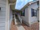 Charming home entrance with a welcoming front porch and well-manicured landscaping at 17145 Park Trail Dr, Monument, CO 80132