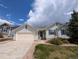 Charming single-Gathering home with well-maintained front yard and attached two-car garage in a quiet neighborhood at 17145 Park Trail Dr, Monument, CO 80132