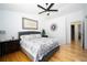 Bright bedroom with hardwood floors, stylish decor, and a comfortable queen-sized bed at 17145 Park Trail Dr, Monument, CO 80132