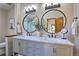 Elegant bathroom with double vanity and marble at 6220 Arapahoe Dr, Evergreen, CO 80439