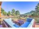 Deck overlooking mountain landscape, seating area at 6220 Arapahoe Dr, Evergreen, CO 80439