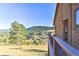 Deck with mountain views and railing at 6220 Arapahoe Dr, Evergreen, CO 80439