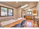 Dining area with kitchen and wood table at 6220 Arapahoe Dr, Evergreen, CO 80439