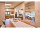 Dining area with kitchen views and wood table at 6220 Arapahoe Dr, Evergreen, CO 80439