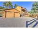 Two-car garage and charming two-story home with mountain views at 6220 Arapahoe Dr, Evergreen, CO 80439