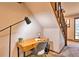 Home office with desk and chair, near staircase at 6220 Arapahoe Dr, Evergreen, CO 80439