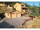 Two-car garage and expansive driveway at 6220 Arapahoe Dr, Evergreen, CO 80439