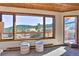 Living room with large windows and mountain views at 6220 Arapahoe Dr, Evergreen, CO 80439