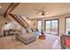 Living room with L-shaped sofa and mountain views at 6220 Arapahoe Dr, Evergreen, CO 80439