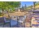 Stone patio with seating area and mountain views at 6220 Arapahoe Dr, Evergreen, CO 80439