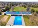 Community aerial showcasing a pool, tennis courts, and fields, surrounded by lush landscaping at 3383 S Boston Ct, Denver, CO 80231