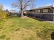 Expansive backyard with a large grassy area, perfect for outdoor activities and entertaining guests at 3383 S Boston Ct, Denver, CO 80231