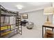 Functional bedroom with loft bed, study space, and TV for relaxation at 3383 S Boston Ct, Denver, CO 80231