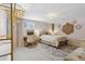 Serene bedroom featuring a gold accents, decorative wall art, and a work space at 3383 S Boston Ct, Denver, CO 80231
