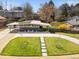 Modern home featuring a well-manicured lawn and inviting entrance with solar panels at 3383 S Boston Ct, Denver, CO 80231