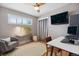 Inviting home office features hardwood floors, bright window, modern lighting and stylish decor at 3383 S Boston Ct, Denver, CO 80231