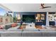 Comfortable living room featuring a large sectional sofa and stylish decor at 3383 S Boston Ct, Denver, CO 80231