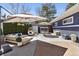Inviting patio space featuring comfortable lounge seating and an outdoor dining area at 3383 S Boston Ct, Denver, CO 80231