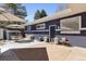 Charming patio with an outdoor dining and seating area for relaxing and entertaining at 3383 S Boston Ct, Denver, CO 80231