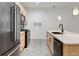 Contemporary kitchen boasting stainless steel appliances and an island at 10155 Morrison Rd, Lakewood, CO 80227