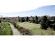 Scenic aerial view of a neighborhood with lush green spaces and walking path at 2261 W Briarwood Ave, Littleton, CO 80120