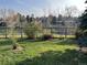 Spacious, well-kept backyard with mature trees and partial fence, perfect for outdoor enjoyment at 2261 W Briarwood Ave, Littleton, CO 80120