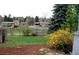 Expansive backyard featuring mature trees, lush greenery, and a peaceful setting at 2261 W Briarwood Ave, Littleton, CO 80120