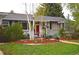 Inviting home exterior featuring a colorful front yard with cozy seating at 2261 W Briarwood Ave, Littleton, CO 80120