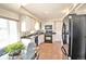Bright kitchen with white cabinets, black appliances, and ample counter space at 2261 W Briarwood Ave, Littleton, CO 80120