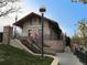 Stone train station building with a pathway, lampposts, and manicured lawn at 2261 W Briarwood Ave, Littleton, CO 80120