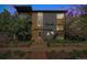 Charming Lea Plaza apartment building with brick facade, lush landscaping, and inviting entrance at 200 N Sherman St # 2, Denver, CO 80203