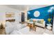 Cozy living room featuring modern decor, comfortable seating, and stylish accents against a vibrant blue accent wall at 200 N Sherman St # 2, Denver, CO 80203