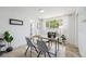 Bright home office featuring a large window, neutral-toned walls, sleek desk and chair and modern decor at 200 N Sherman St # 2, Denver, CO 80203