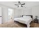 Bright bedroom with a ceiling fan and ensuite bathroom featuring a modern vanity at 7453 S Norfolk St, Aurora, CO 80016