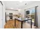 Bright kitchen featuring stainless steel appliances, granite countertops, and sliding door access to the backyard at 7453 S Norfolk St, Aurora, CO 80016