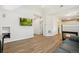 Bright living room featuring light wood floors, fireplace, and plenty of natural light from the large window at 7453 S Norfolk St, Aurora, CO 80016