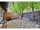 Backyard patio area with brick pavers, a grill, and a fenced perimeter for outdoor enjoyment at 2955 N Gilpin St, Denver, CO 80205